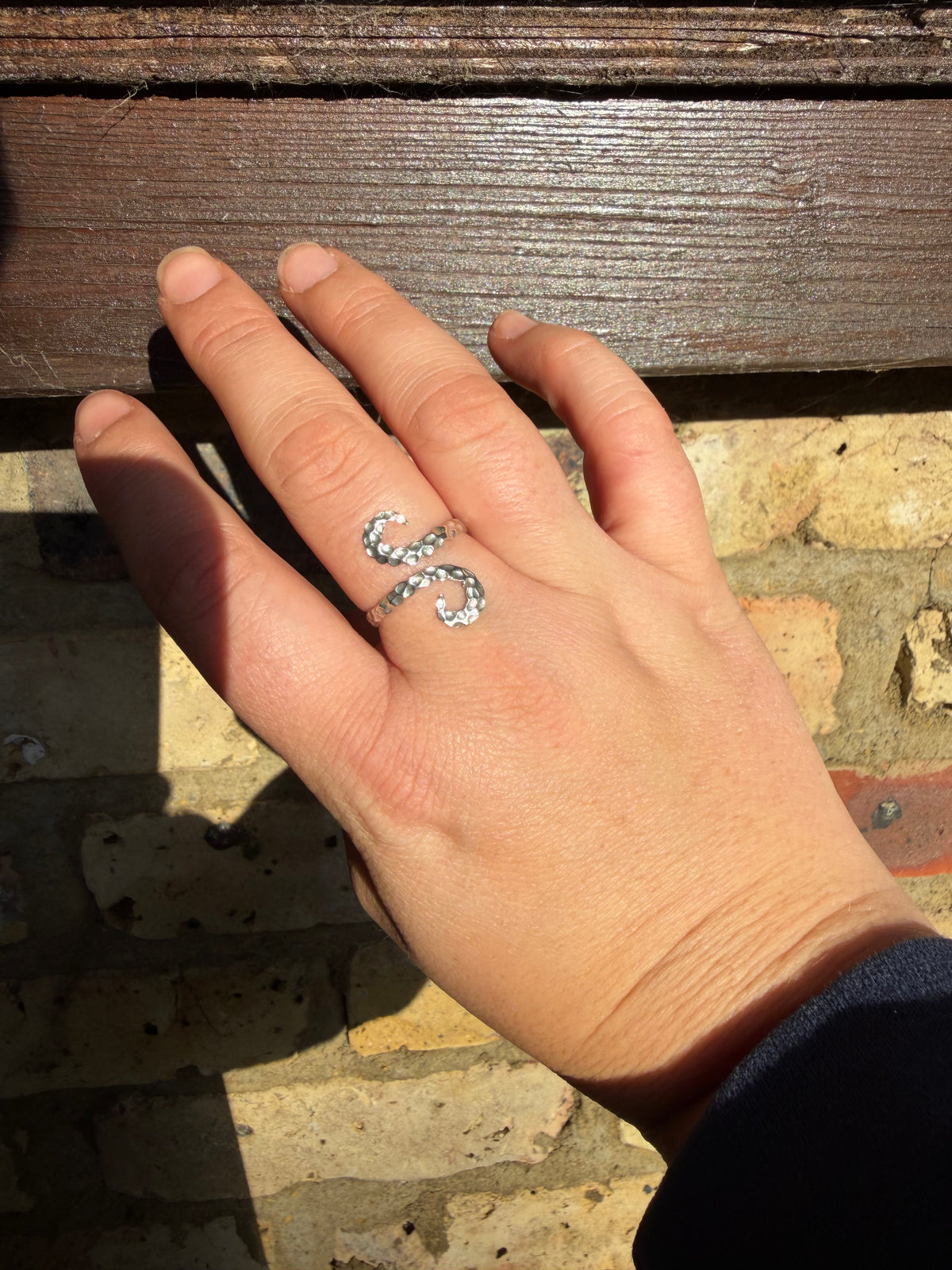 Octopus tentacle ring handmade using recycled sterling silver adjustable Being worn 